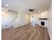Spacious living area with fireplace, wood floors, and staircase at 3723 Verde Glen Ln, Cumming, GA 30040