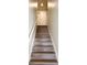 Stylish staircase leading to the upper level featuring modern flooring and white trim at 3723 Verde Glen Ln, Cumming, GA 30040