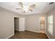 Bright bedroom features tray ceiling, ceiling fan, and adjacent bathroom access offer comfort and convenience at 4486 Thorngate Ln, Acworth, GA 30101
