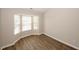 Bright bedroom features a bay window, wood flooring, and neutral colors to easily customize to your liking at 4486 Thorngate Ln, Acworth, GA 30101