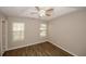 Cozy bedroom with natural light, trey ceiling, and wood flooring, offers a relaxing and comfortable atmosphere at 4486 Thorngate Ln, Acworth, GA 30101