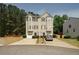 Traditional two-story townhome boasts a private driveway and a well-manicured front yard at 4486 Thorngate Ln, Acworth, GA 30101