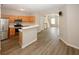 Kitchen features stainless appliances and an open view to the living area at 4486 Thorngate Ln, Acworth, GA 30101