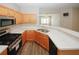 Kitchen view with stainless appliances and counter seating space at 4486 Thorngate Ln, Acworth, GA 30101