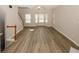 Bright living room with wood floors and stairway to upper floor at 4486 Thorngate Ln, Acworth, GA 30101
