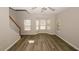 Open living area with hardwood floors, a staircase, and lots of natural light at 4486 Thorngate Ln, Acworth, GA 30101