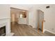 Living room featuring a fireplace, wood floors, and view to the kitchen at 4486 Thorngate Ln, Acworth, GA 30101