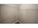 Walk-in closet with wire shelving for easy storage of shoes and clothing at 4486 Thorngate Ln, Acworth, GA 30101