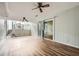 Spacious basement featuring sliding glass doors to a walkout and two ceiling fans at 6125 Dunbritan Ln, Atlanta, GA 30349