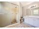 Outdated bathroom with tiled shower, vanity and flooring at 6125 Dunbritan Ln, Atlanta, GA 30349