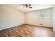 Bedroom features wood-look flooring and natural light at 6125 Dunbritan Ln, Atlanta, GA 30349