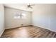 Bedroom features wood-look flooring and natural light at 6125 Dunbritan Ln, Atlanta, GA 30349