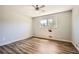 Bedroom features wood-look flooring and natural light at 6125 Dunbritan Ln, Atlanta, GA 30349