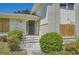 Covered entry with manicured bushes, brick accents, and walkway at 6125 Dunbritan Ln, Atlanta, GA 30349
