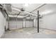 Large garage with two garage doors, concrete floor, and lighting at 6125 Dunbritan Ln, Atlanta, GA 30349