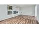 Light and airy living room with durable laminate flooring at 6125 Dunbritan Ln, Atlanta, GA 30349