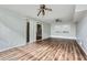 Spacious living room with wood-look floors and sliding glass doors at 6125 Dunbritan Ln, Atlanta, GA 30349
