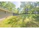 Spacious backyard with well-maintained lawn and enclosed sunroom attached to the house at 7268 Westwood Ln, Douglasville, GA 30134