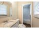 Bathroom featuring granite countertop, modern faucet, toilet, and a tiled shower/tub at 7268 Westwood Ln, Douglasville, GA 30134