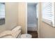 Updated bathroom with granite countertop, white cabinets, and tiled shower/tub at 7268 Westwood Ln, Douglasville, GA 30134