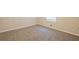 This bedroom offers carpet, base molding, and a sunny window at 7268 Westwood Ln, Douglasville, GA 30134