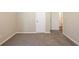 Carpeted bedroom with white trim and view of adjacent rooms at 7268 Westwood Ln, Douglasville, GA 30134