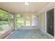 Bright sunroom with tile flooring and access to the back door at 7268 Westwood Ln, Douglasville, GA 30134