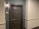 Apartment door with unit number and modern wall-mounted light fixture at 901 Abernathy Ne Rd # 5050, Atlanta, GA 30328