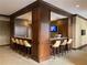 A stylish bar area features seating and a TV, perfect for entertaining guests or relaxing with neighbors at 901 Abernathy Ne Rd # 5050, Atlanta, GA 30328
