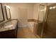 Bathroom featuring a glass-enclosed shower, bathtub, and double vanity at 901 Abernathy Ne Rd # 5050, Atlanta, GA 30328