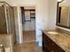 Bathroom featuring a glass enclosed shower, granite counters, and walk in closet at 901 Abernathy Ne Rd # 5050, Atlanta, GA 30328