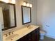 Bathroom with double sinks, vanity, and framed mirrors at 901 Abernathy Ne Rd # 5050, Atlanta, GA 30328