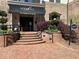 Welcoming entrance to Serrano building with brick walkway and lush greenery at 901 Abernathy Ne Rd # 5050, Atlanta, GA 30328