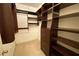 Walk-in closet featuring custom shelving and drawers for optimal organization at 901 Abernathy Ne Rd # 5050, Atlanta, GA 30328