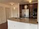Updated kitchen with granite countertops, stainless steel appliances, and modern pendant lighting at 901 Abernathy Ne Rd # 5050, Atlanta, GA 30328