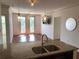 Modern kitchen featuring granite countertops and stainless steel sink, open to the dining area at 901 Abernathy Ne Rd # 5050, Atlanta, GA 30328