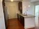 Chic kitchen with granite counters, stainless appliances, and hardwood floors at 901 Abernathy Ne Rd # 5050, Atlanta, GA 30328