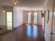 Inviting living room with hardwood floors, balcony access, and stylish modern lighting at 901 Abernathy Ne Rd # 5050, Atlanta, GA 30328