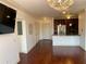 Spacious open living area with hardwood floors, modern chandelier, and access to other rooms at 901 Abernathy Ne Rd # 5050, Atlanta, GA 30328