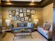 Inviting lounge area with comfortable seating and a gallery wall provides a relaxing and stylish space for residents at 901 Abernathy Ne Rd # 5050, Atlanta, GA 30328