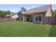 Large fenced yard with a covered patio; perfect for outdoor activities and privacy at 238 Dorothy Ln, Lawrenceville, GA 30046
