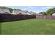 Expansive green backyard with wooden fencing for privacy and outdoor enjoyment at 238 Dorothy Ln, Lawrenceville, GA 30046