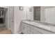 Bathroom with double sink vanity, granite countertop, and walk-in closet at 238 Dorothy Ln, Lawrenceville, GA 30046