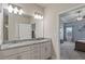 Bright bathroom featuring double vanity and view of the bedroom at 238 Dorothy Ln, Lawrenceville, GA 30046