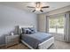 Cozy bedroom features a comfortable bed, soft carpet, and a window that provides natural light at 238 Dorothy Ln, Lawrenceville, GA 30046