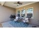 Cozy covered patio with a grill, table, and two chairs for outdoor dining and relaxation at 238 Dorothy Ln, Lawrenceville, GA 30046