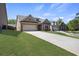 Beautiful single-Gathering home with stone accents, a two-car garage and a lush lawn in a neighborhood at 238 Dorothy Ln, Lawrenceville, GA 30046