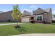 Inviting single-Gathering home with a manicured lawn and stone accents on the facade in a Gathering-friendly community at 238 Dorothy Ln, Lawrenceville, GA 30046