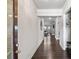 Welcoming hallway with dark hardwood floors and neutral walls that leads to the living area at 238 Dorothy Ln, Lawrenceville, GA 30046
