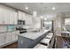 Eat-in kitchen offers white cabinets, granite countertops, and stainless steel appliances at 238 Dorothy Ln, Lawrenceville, GA 30046
